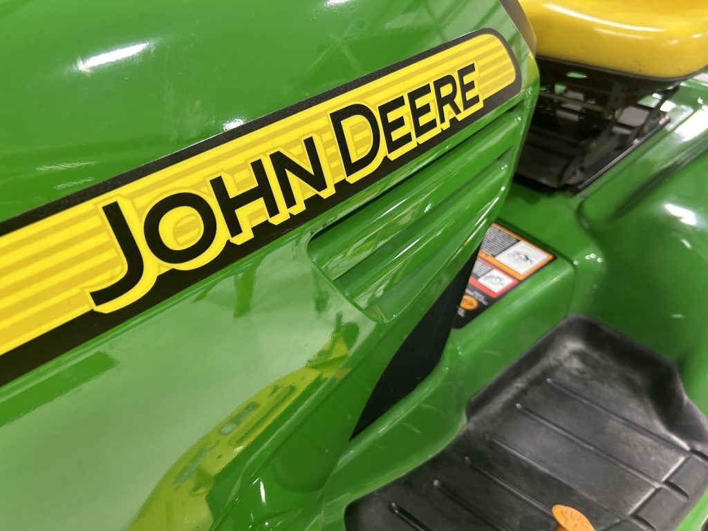 Close-up of a shining John Deere lawn tractor after exterior detailing